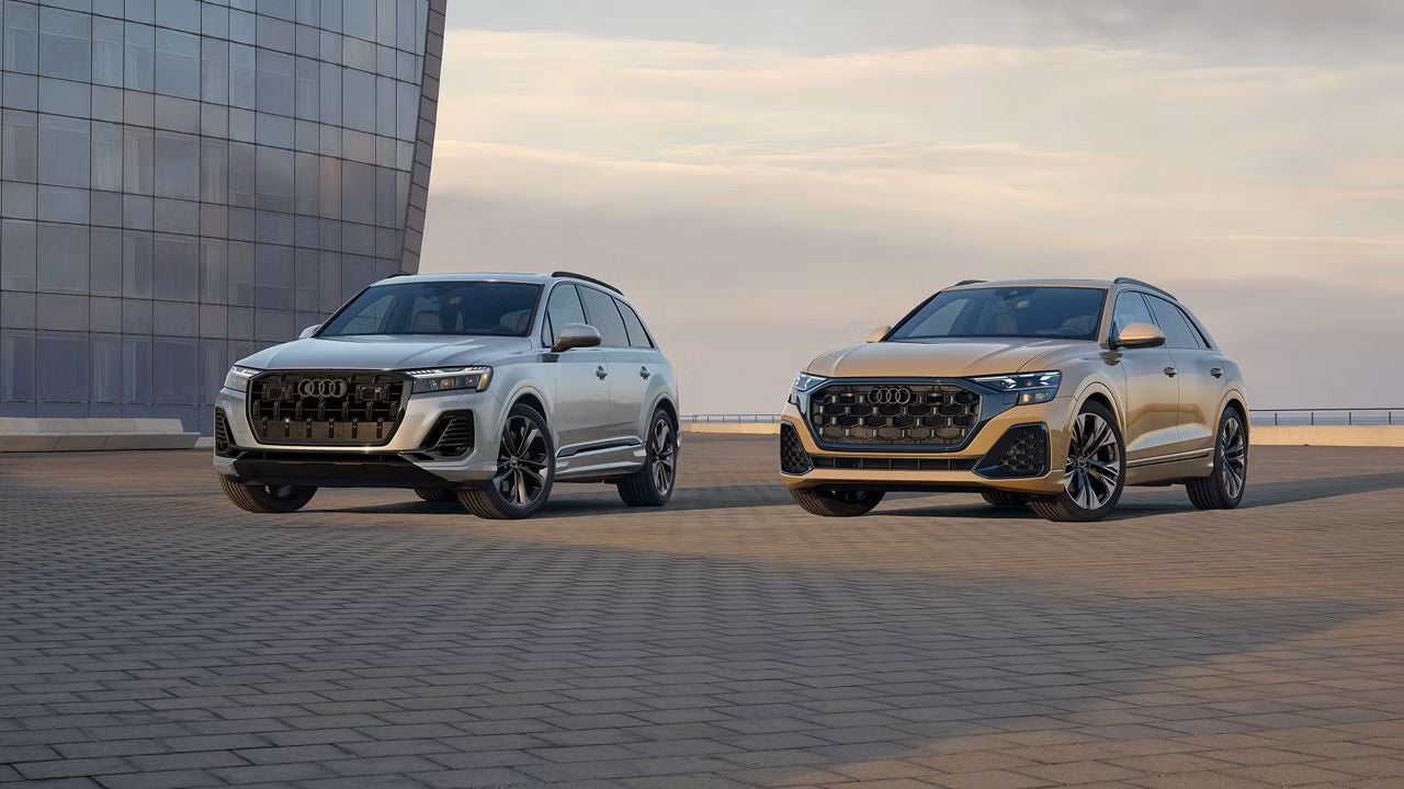 Two new Audi e-tron SUV's parked side by side